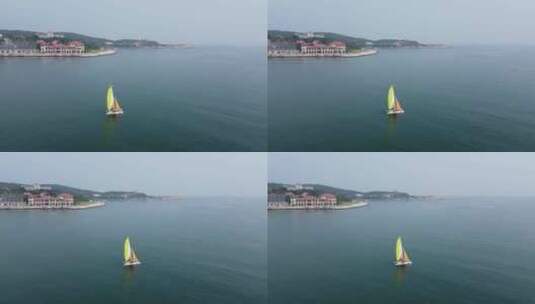 航拍在大海上飘浮的帆船自然风光高清在线视频素材下载