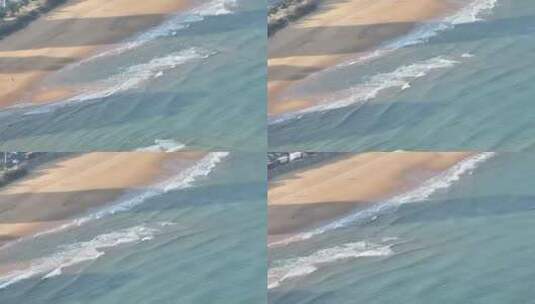 航拍俯瞰山东威海国际海水浴场沙滩上的海浪高清在线视频素材下载