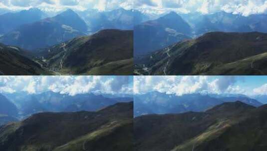 航拍连绵起伏的山脉被白云笼罩高清在线视频素材下载