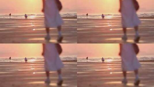 烟台夏天海边落日夕阳，女孩在沙滩上走动高清在线视频素材下载