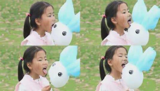吃棉花糖可爱微笑小女孩高清在线视频素材下载
