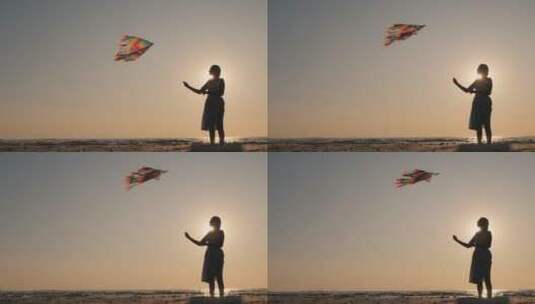 女人带着风筝的剪影侧视图高清在线视频素材下载