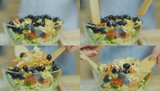 一个人在玻璃碗里搅拌蔬菜沙拉高清在线视频素材下载