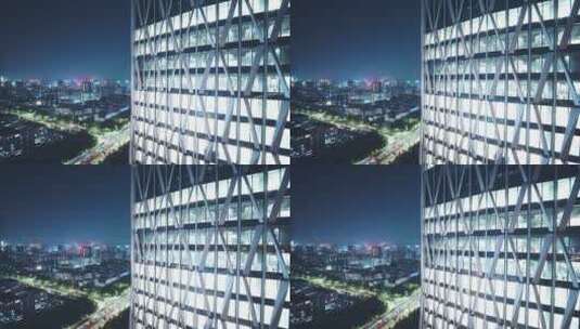 航拍夜晚杭州滨江灯火通明的现代办公大楼高清在线视频素材下载