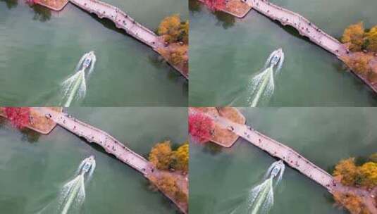 快艇穿过湖上石拱桥高清在线视频素材下载