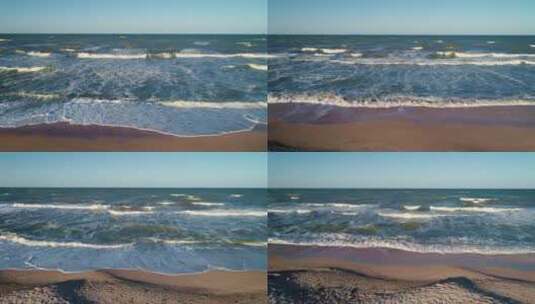 海浪拍打着海滩上的沙子高清在线视频素材下载