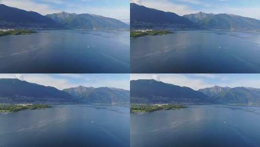 瑞士马焦雷湖上划船的无人驾驶飞机视图。高清在线视频素材下载