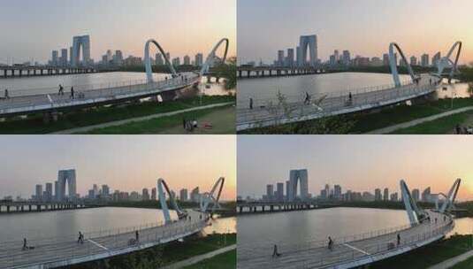 高清航拍4K苏州园区金鸡湖步行桥夕阳落日高清在线视频素材下载