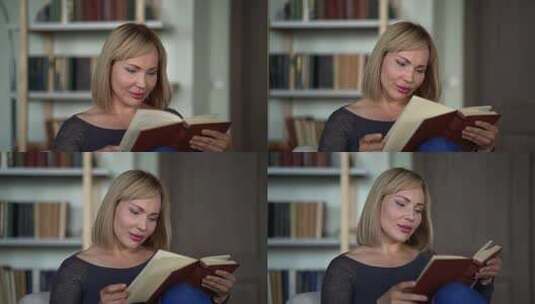 一个嘴唇上涂着明亮口红的金发女郎坐在书架和翻转的背景下高清在线视频素材下载