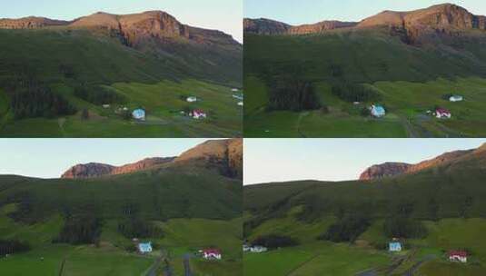 午夜阳光冰岛蓝色小屋，斯堪的纳维亚半岛的村庄。无人机射击高清在线视频素材下载