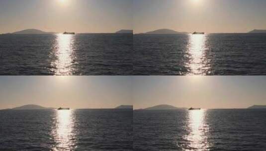 阳光明媚的傍晚，在马尔马拉海上航行的渡船剪影。阳光反射和遥远的岛屿高清在线视频素材下载