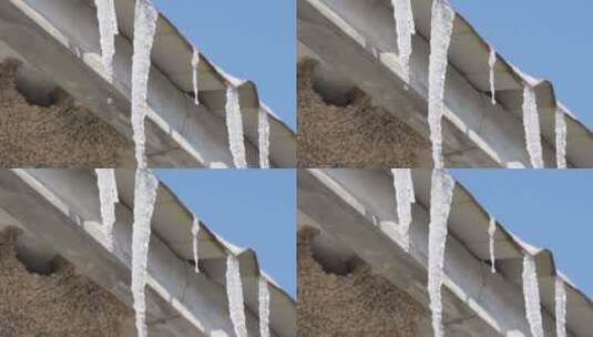 屋檐上的冰柱滴水高清在线视频素材下载