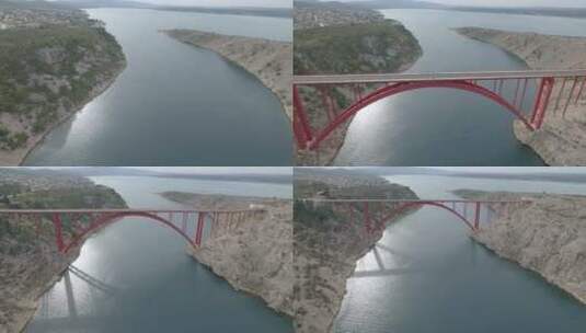 克罗地亚马斯莱尼察桥。乔治的红色钢桥。马斯莱尼察海峡的景色。向后飞行高清在线视频素材下载