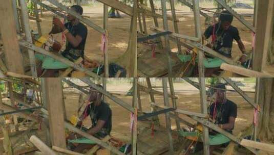 贫困非洲男孩手工制作织布高清在线视频素材下载