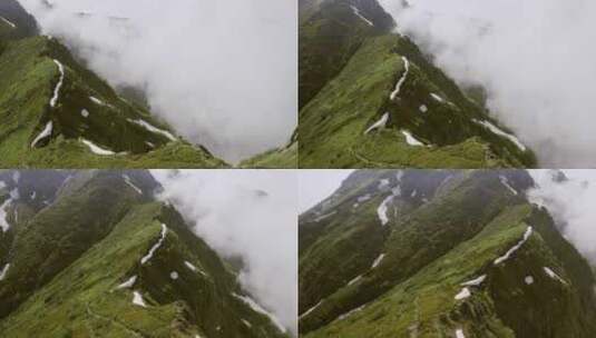 航拍被山峰隔断的云雾和青山高清在线视频素材下载
