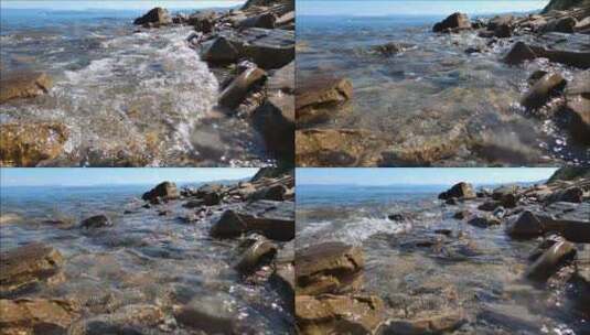 海浪拍打着岩石海岸高清在线视频素材下载