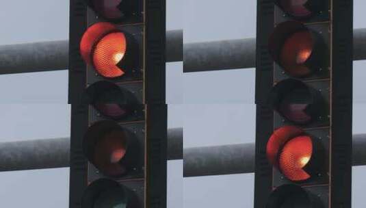 交通信号灯上闪烁的橙色灯高清在线视频素材下载
