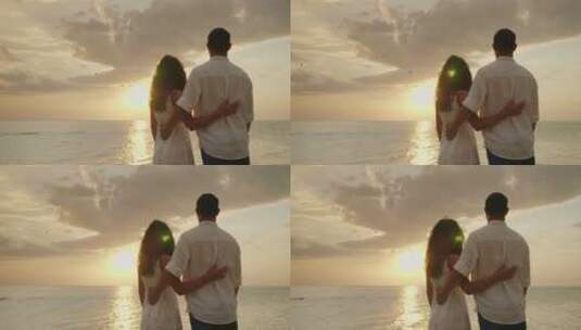 恋爱中的夫妇欣赏海上日落高清在线视频素材下载