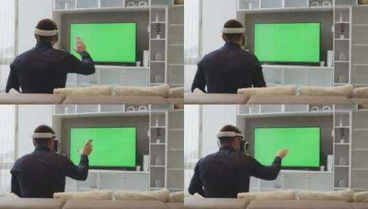 男人带着虚拟现实眼镜看着绿屏高清在线视频素材下载