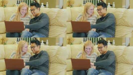夫妇在沙发上用电脑 高清在线视频素材下载