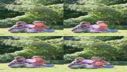 升格秋天午后两个坐在草坪上玩气球的女孩高清在线视频素材下载