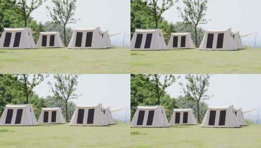 阳光下草地上露营的帐篷航拍高清在线视频素材下载