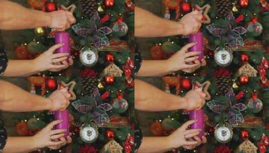 在圣诞树附近点燃蜡烛的特写高清在线视频素材下载