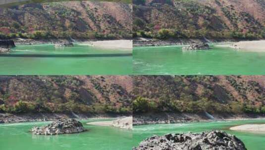 绿色江水和江中巨石高清在线视频素材下载