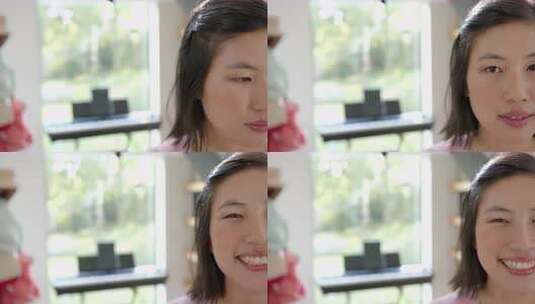 微笑的亚洲女人，背景是钢琴，在家享受时光高清在线视频素材下载