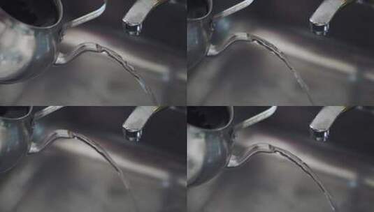 从水壶里倒出多余的水高清在线视频素材下载