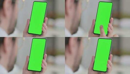 男性使用带有绿色屏幕的智能手机高清在线视频素材下载