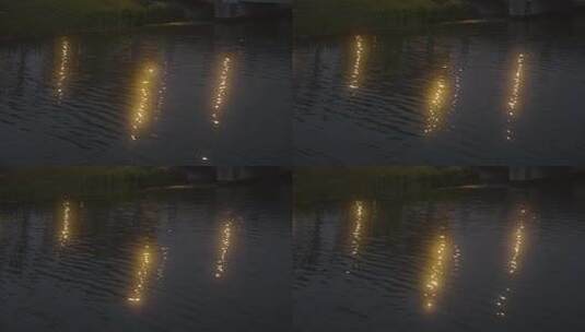 夜晚湖面路灯水波纹光晕4K高清在线视频素材下载