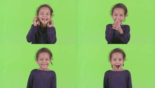 非裔美国儿童展示舌头。绿屏高清在线视频素材下载
