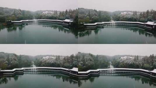 航拍杭州西湖景区浴鹄湾霁虹桥雪景高清在线视频素材下载