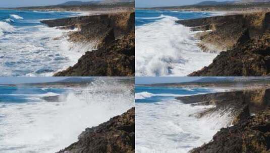 阳光明媚的白天海景毁灭性和壮观的海上风暴海浪撞击在岩石上高清在线视频素材下载