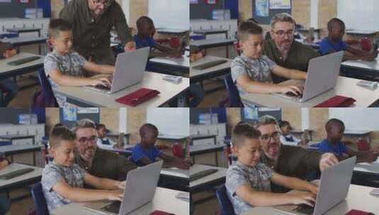 多样化的男老师帮助一个坐在教室里的男生使用笔记本电脑高清在线视频素材下载