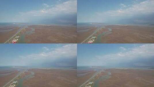 大海海边沙滩风车发电新能源蓝天白云航拍高清在线视频素材下载
