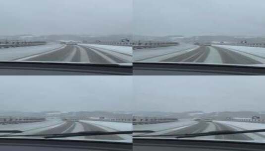 竖屏-第一视角驾车行驶在冰雪覆盖的桥梁上高清在线视频素材下载