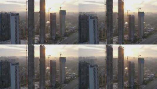 日出时分的城市建筑工地4k航拍高清在线视频素材下载