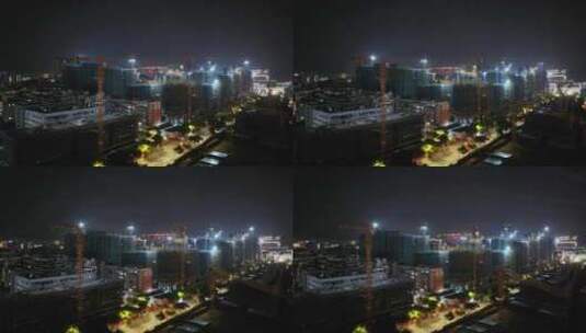 建筑工地施工航拍夜景剪影视频塔吊建设城市高清在线视频素材下载