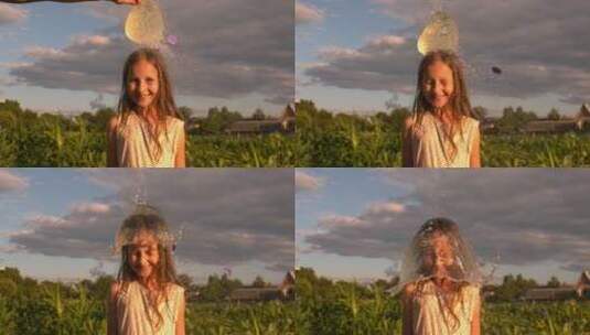 装满水的气球在小女孩头顶扎破高清在线视频素材下载