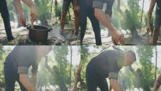 男人在野外露营时烹饪高清在线视频素材下载