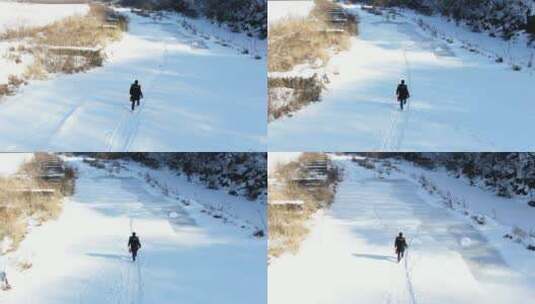 航拍东北冬天雪地行走，滑冰高清在线视频素材下载