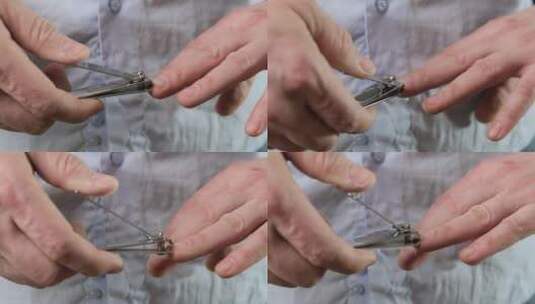 用指甲钳在男人手上剪指甲。特写。高清在线视频素材下载