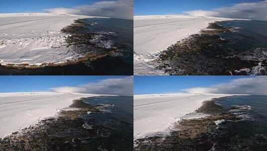 FPV无人机航拍冬日雪景海岸海浪群岛海鸟高清在线视频素材下载