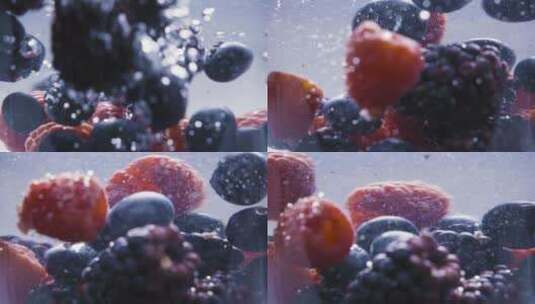 什锦浆果落在水上的慢动作高清在线视频素材下载