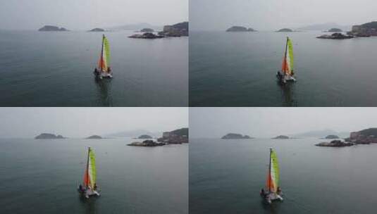 航拍在大海上飘浮的帆船自然风光高清在线视频素材下载
