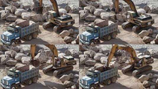 挖掘起重机将岩石吊上卡车高清在线视频素材下载
