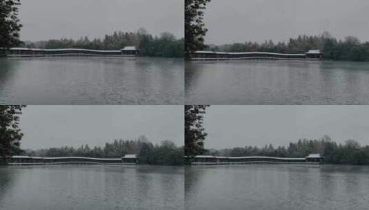 航拍杭州西湖景区浴鹄湾霁虹桥雪景高清在线视频素材下载