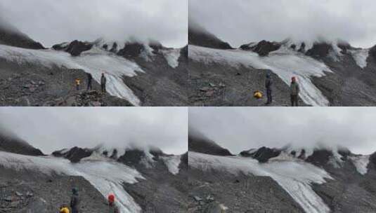 航拍攀登川西贡嘎山卫峰乌库楚雪山的登山者高清在线视频素材下载